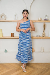 One-shoulder linen maxi with flared hemline that can be made to your measurement or customized to match your unique style.