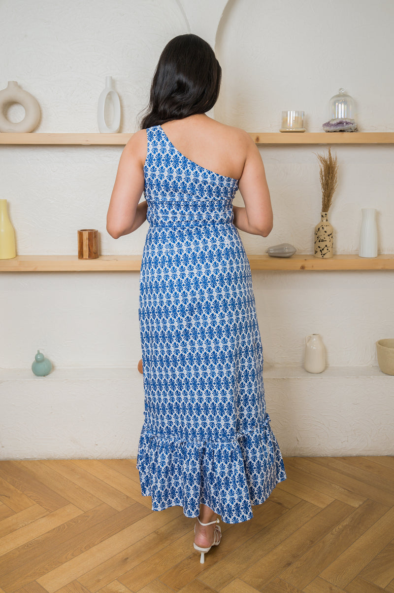 One-shoulder linen maxi with flared hemline that can be made to your measurement or customized to match your unique style.